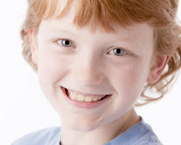 A closeup headshot of a caucasian smiling little real boy — Stock Photo, Image