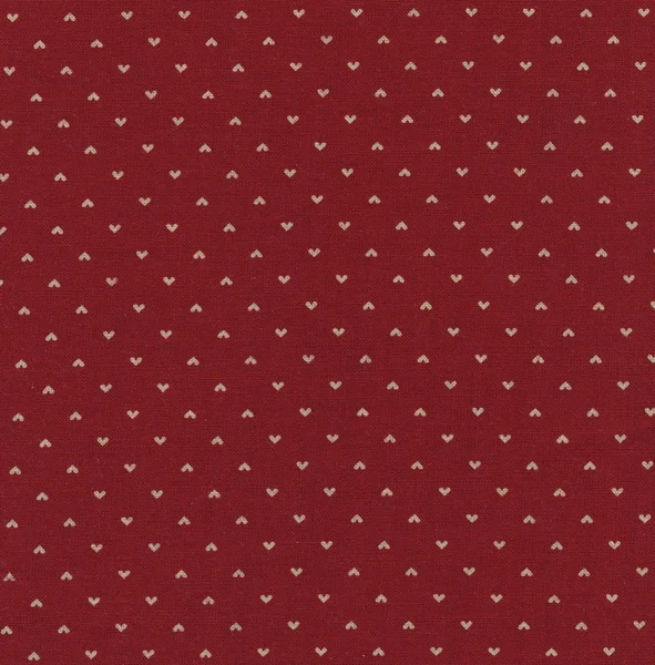 A high resolution small white heart pattern printed on red fabric for backgrounds — Stock Photo, Image