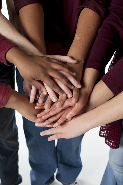 Sports Fans. Group of diverse teenagers putting their hands together Royalty Free Stock Photos