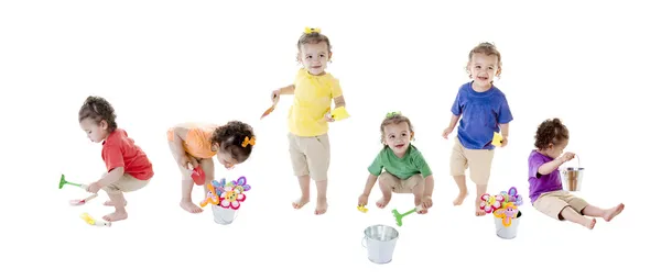 En sammansatt bild montage av en blandad ras barn girl i många färgglada skjortor Stockfoto