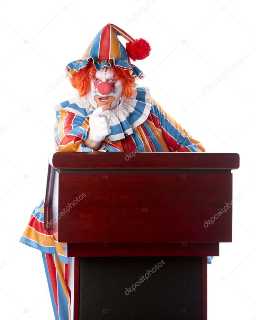 Clowns. Adult clown standing at a podium giving a speech — Stock Photo © jbryson #21424127