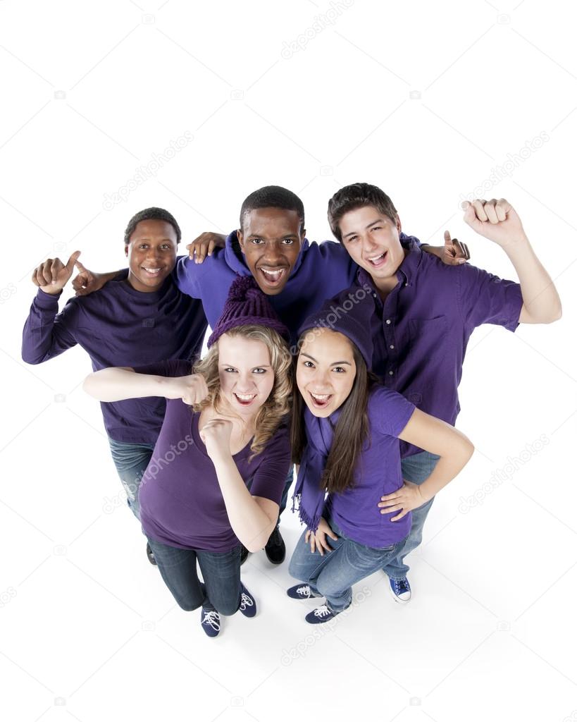 Sports Fans. Group of smiling teenagers standing together as friends for the purple team