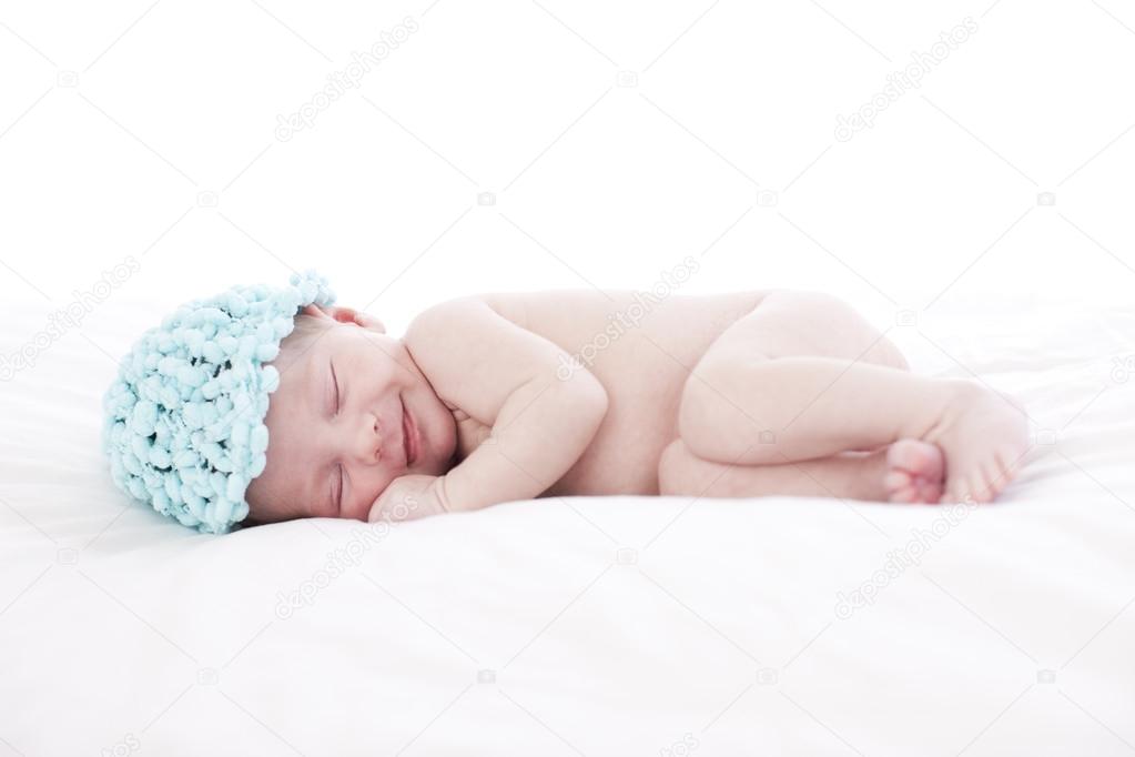 A bare newborn baby boy