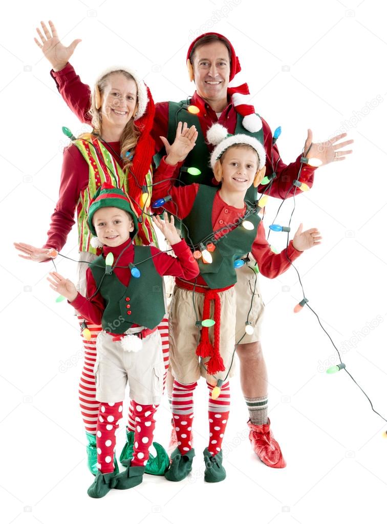 A family of christmas elves is tangled in a string of holiday lights