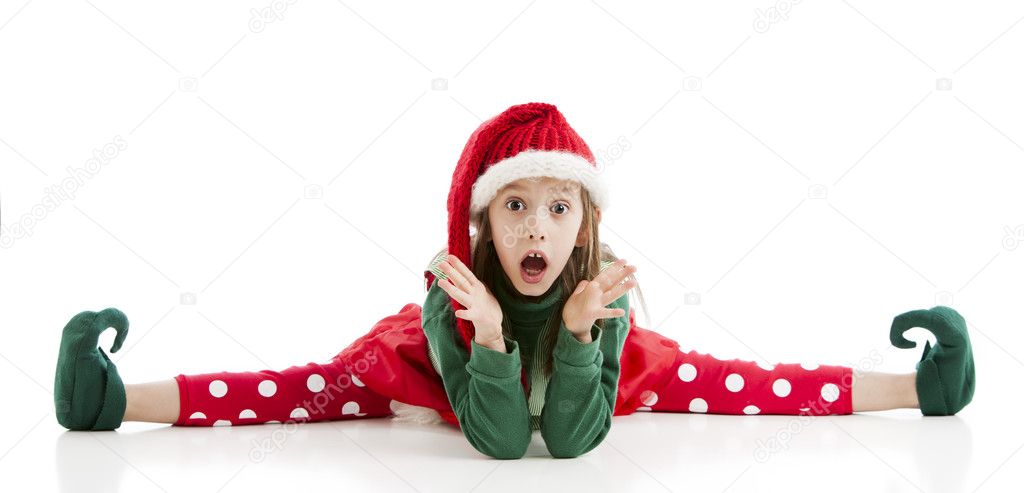 A very limber little girl Christmas elf does the splits