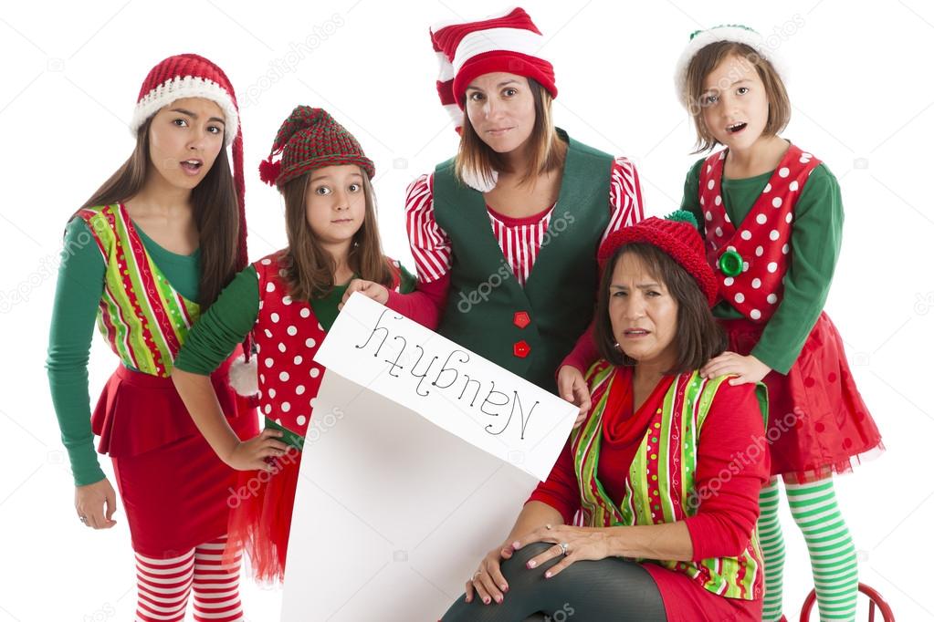 A hispanic family of christmas elves is surprised and disappointed