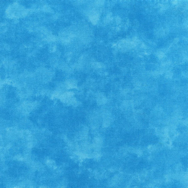 A high resolution bright blue fabric that looks like tie dye or paint. — Stock Photo, Image