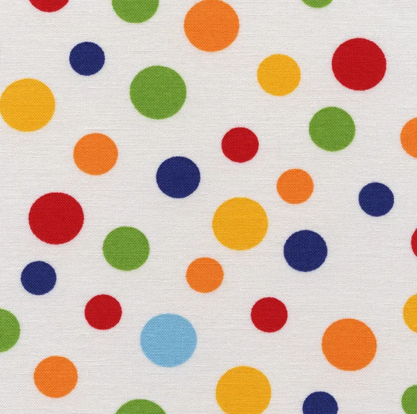 A high resolution white fabric with pastel multicolored polka dots