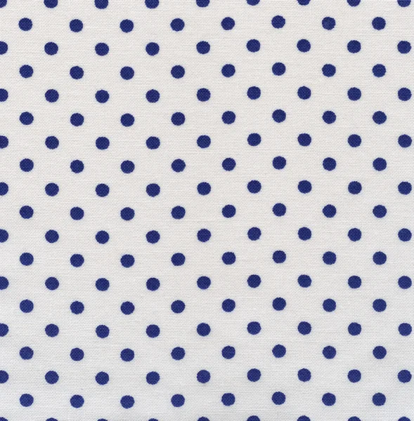 A high resolution white fabric with dark blue polka dots — Stock Photo, Image