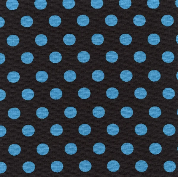 A high resolution black fabric with blue polka dots — Stock Photo, Image