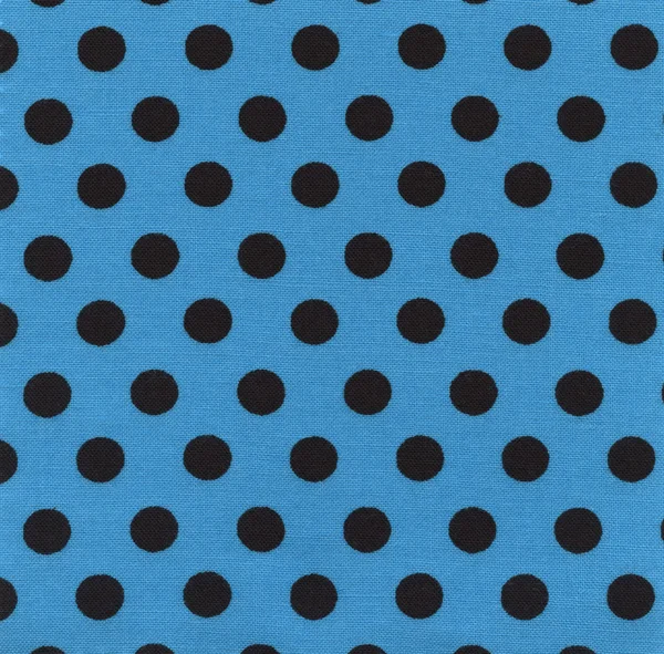 A high resolution blue fabric with black polka dots — Stock Photo, Image