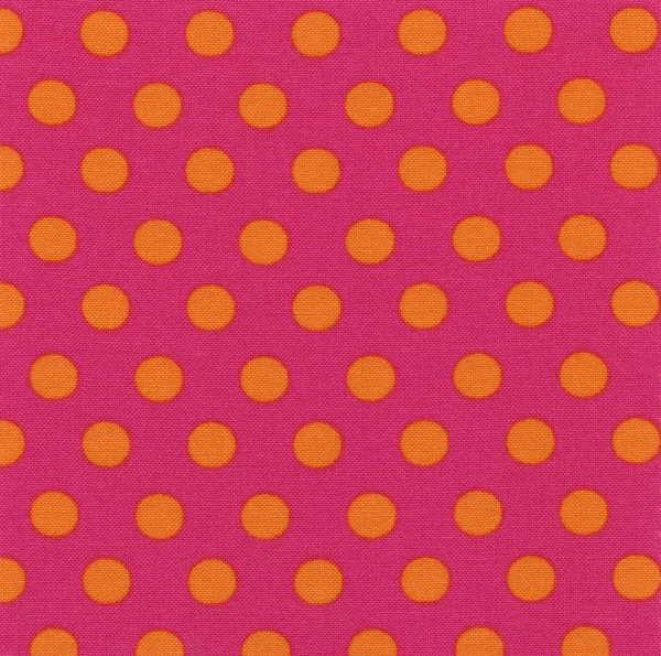 A high resolution pink fabric with orange polka dots — Stock Photo, Image