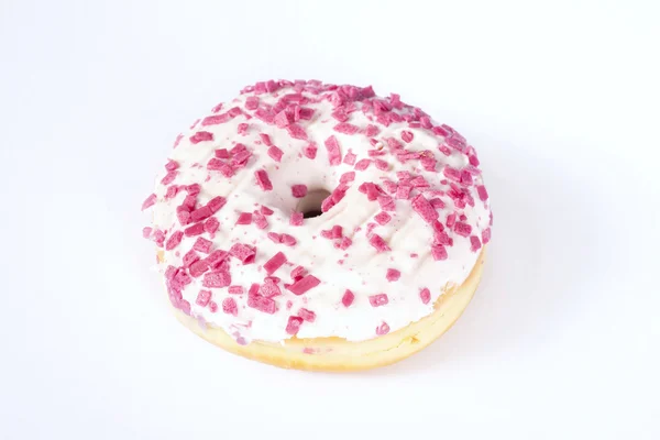 Donut with white glazing and pink sprinkles — Stock Photo, Image