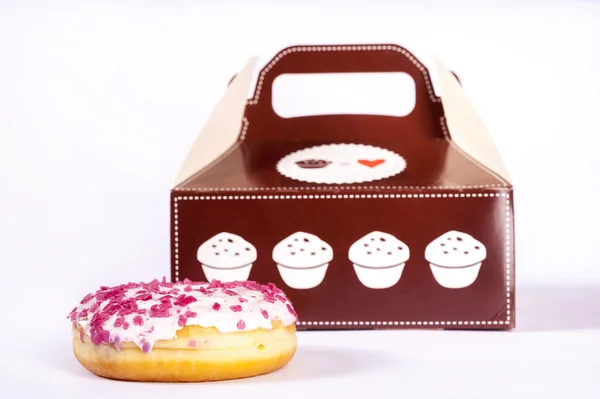Donut in front of box — Stock Photo, Image