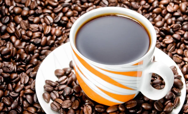 Coffee cup and coffee beans — Stock Photo, Image