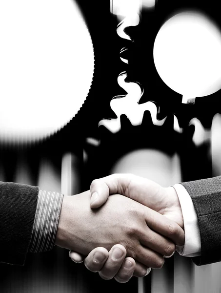 Handshake with gears background — Stock Photo, Image