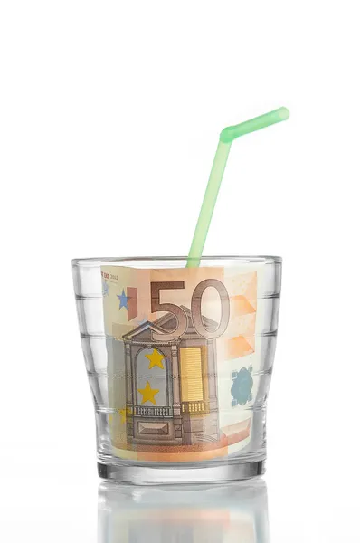 Financial concept: drinking a 50 euro bill in a glass and a stra — Stock Photo, Image