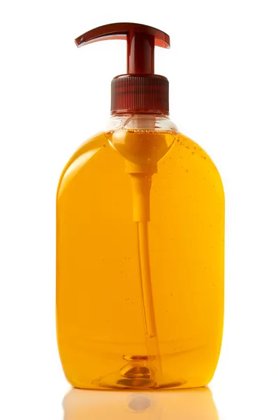 Isolated full bottle of orange liquid soap for hands with back l — Stock Photo, Image