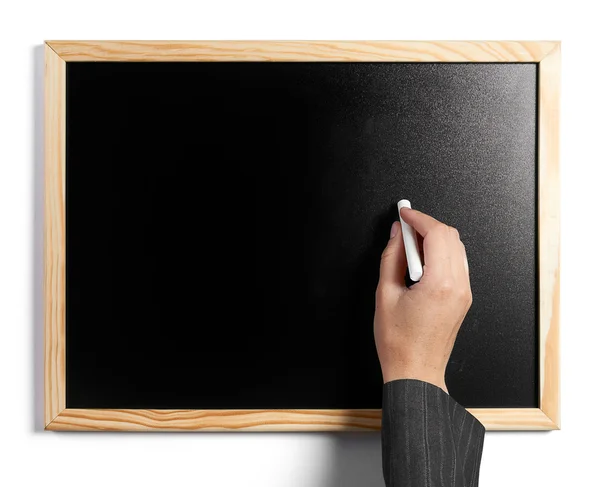 Zakenvrouw schrijven in leeg zwarte bord met een wit krijt — Stockfoto