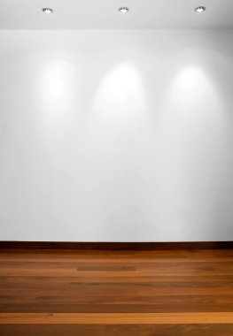 Empty white wall with 3 spot lights and wooden floor clipart