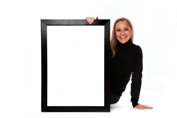 Young woman displaying a banner add isolated over a white background — Stock Photo, Image