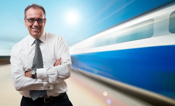 Successful businessman at high speed train — Stock Photo, Image