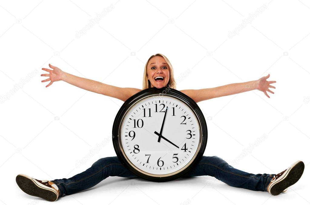 Young happy woman with a clock
