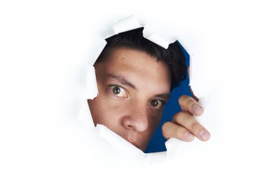 Young man looking through the hole in the white paper clipart