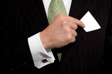 businessman in black costume put or take out credit card in pocket, close up clipart