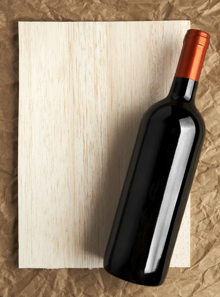 Wine List Design Series: Bottle of red wine over wooden banner — Stock Photo, Image
