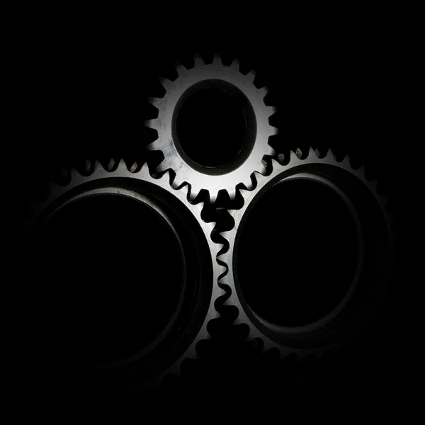 Closeup gears on black — Stock Photo, Image