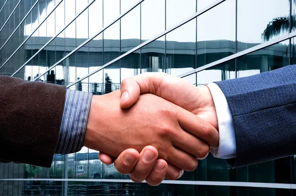 Handshake at business center — Stock Photo, Image