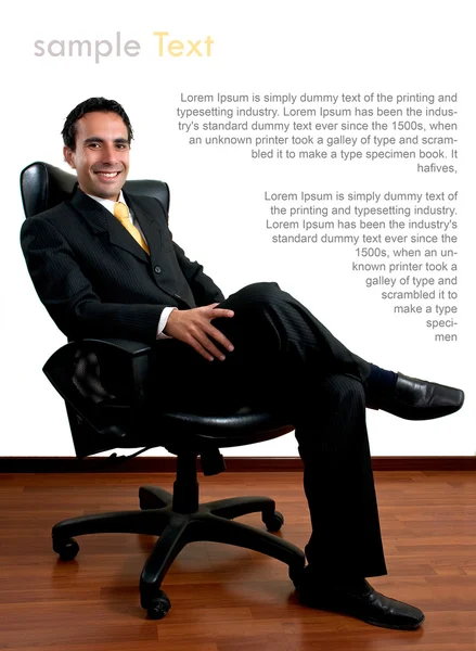 Young successful business man sitting at his office with copy sp — Stock Photo, Image