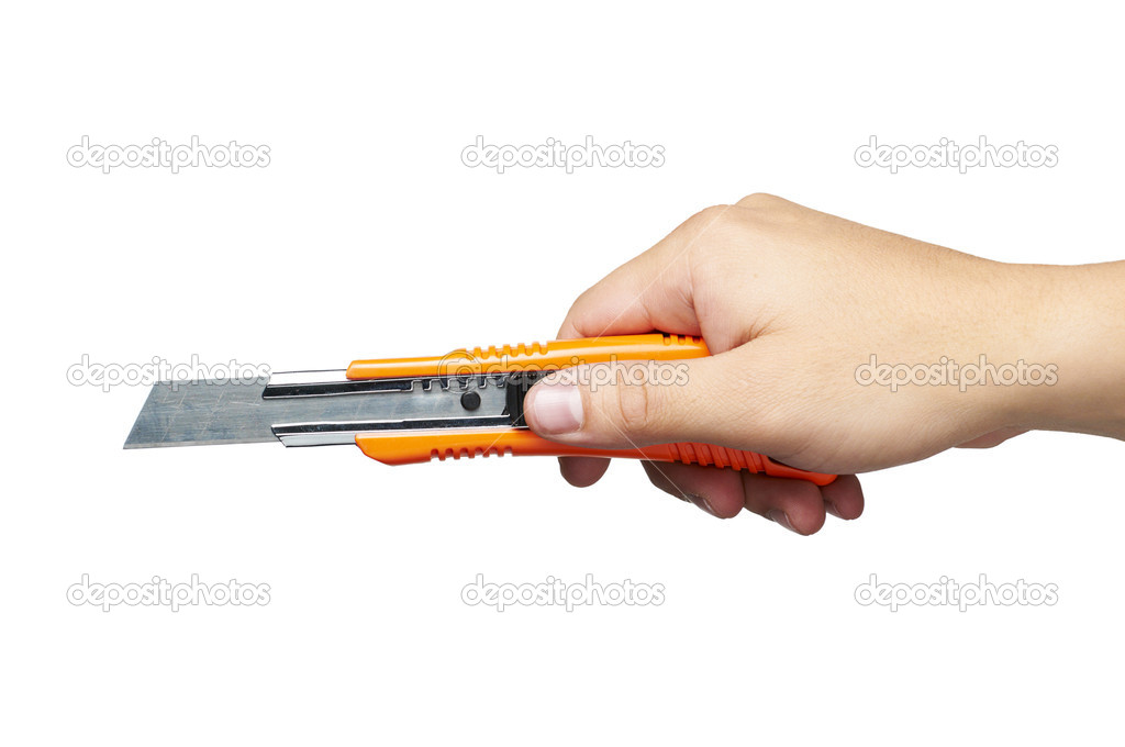 Hand holding a cutter