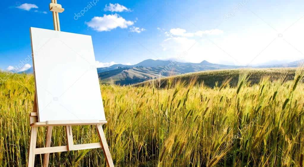 Canvas on tripod on beautiful wheat landcape at the andes mounta