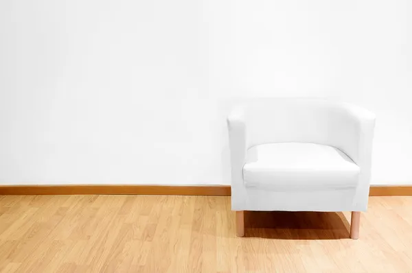 Empty room with a white sofa — Stok fotoğraf