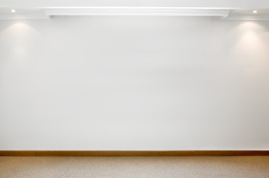 Empty white wall with 2 spot lights and carpeted floor clipart
