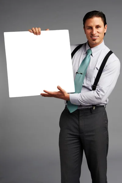 Business man holding white banner — Stock Photo, Image