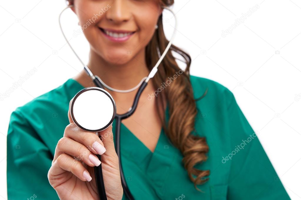 Smiling medical woman doctor with stethoscope. Isolated over whi