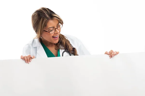 Woman doctor holding white empty banner. — Stock Photo, Image
