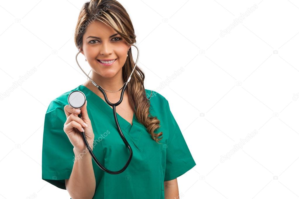 Smiling medical woman doctor with stethoscope. Isolated over whi