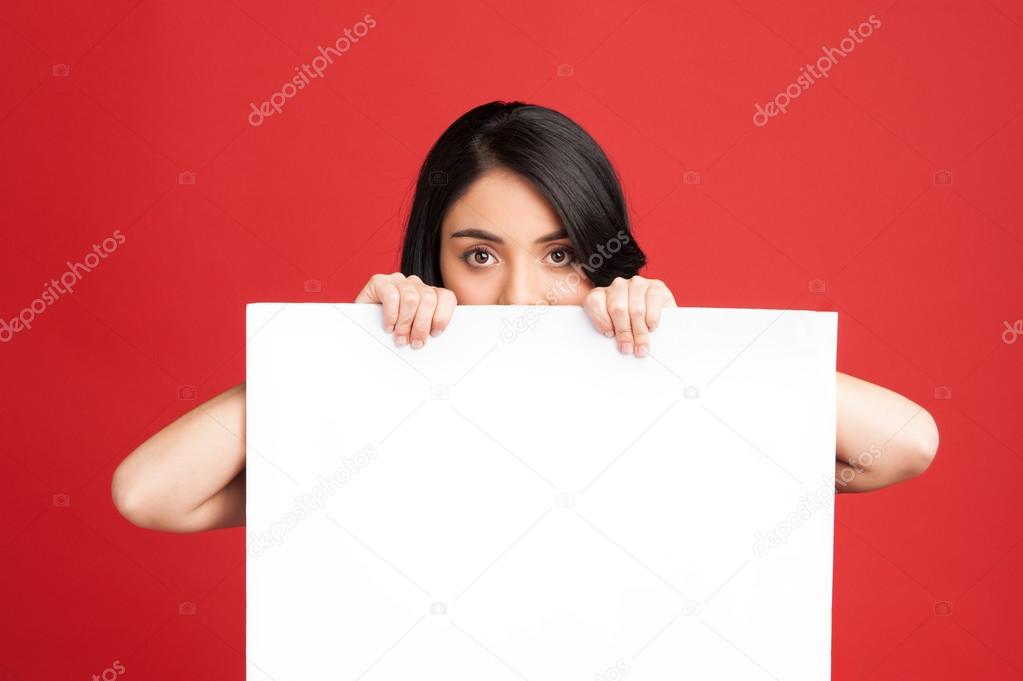 Fitness woman holding white empty banner