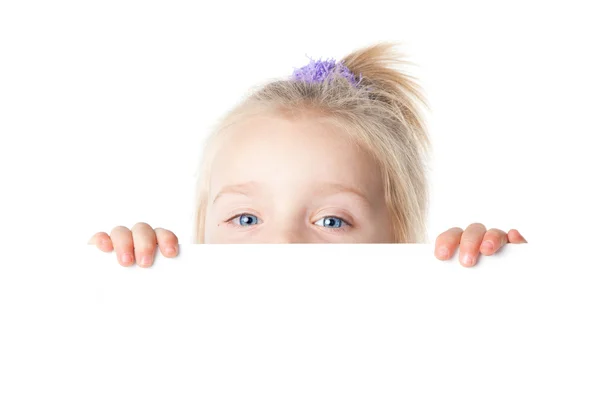 Little girl looking over empty board — Stock Photo, Image