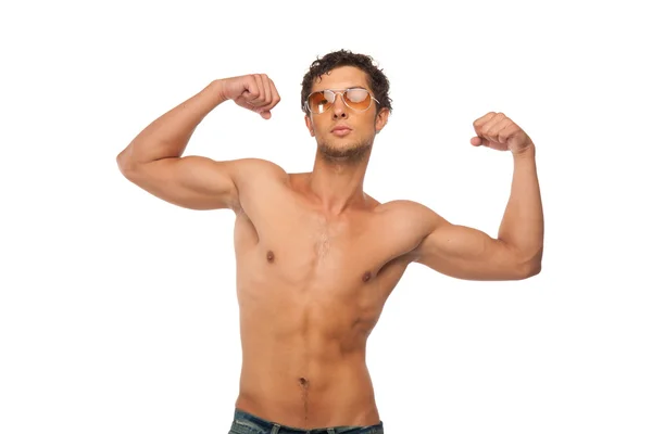 Handsome Athletic man showing muscles isolated — Stock Photo, Image