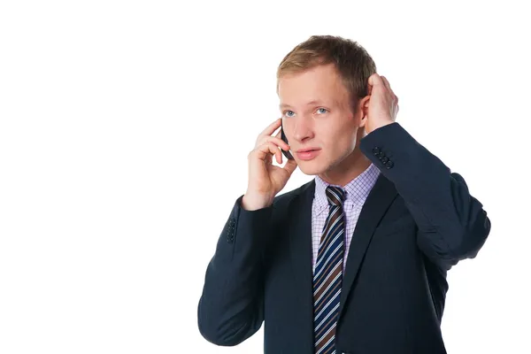 Jóképű üzletember mobiltelefonon beszél — Stock Fotó