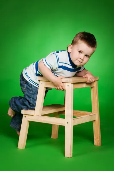 Little boy on stairs in studio — Stock Photo, Image