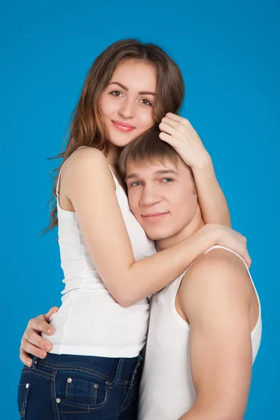 Young love couple holding each other in the studio — Stock Photo, Image