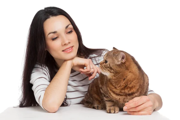 Beautiful smiling brunette girl and her ginger cat over white ba — Stock Photo, Image