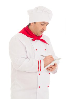 adam whriting bir defter kalem ile pişirmek