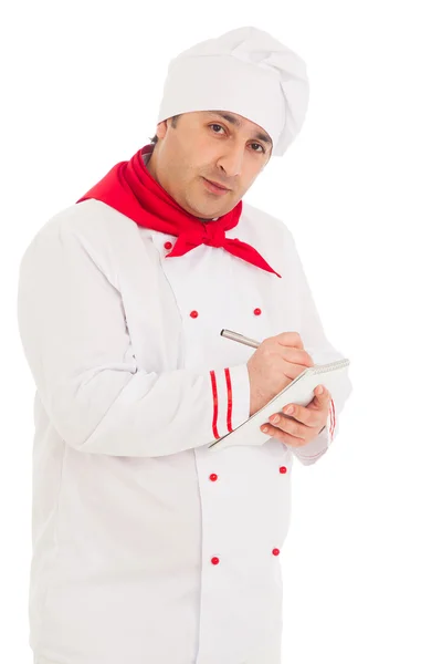 Cuoco uomo whriting qualcosa nel taccuino con penna — Foto Stock